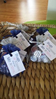 three bags of cookies sitting on top of a wicker basket