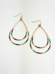 Teal & Orange Beaded Teardrop Earrings Gold Teardrop Earrings With Colorful Beads, Green Teardrop Jewelry For Summer, Beaded Teardrop Earrings For Summer, Bohemian Adjustable Teardrop Earrings With Colorful Beads, Summer Beaded Teardrop Earrings, Adjustable Bohemian Teardrop Earrings With Colorful Beads, Green Teardrop Earrings With Tiny Beads, Gift Teardrop Earrings With Colorful Beads, Bohemian Orange Teardrop Jewelry