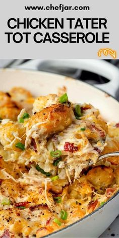 chicken tater tot casserole in a white dish with a serving spoon