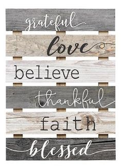 a wooden sign that says grateful love, believe, thank and faith