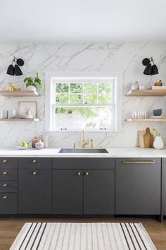 the instagram page on instagram com shows an image of a kitchen with black cabinets and