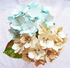 a bouquet of paper flowers on a white background