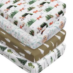 three different types of mattresses stacked on top of each other, one with deer and pine trees