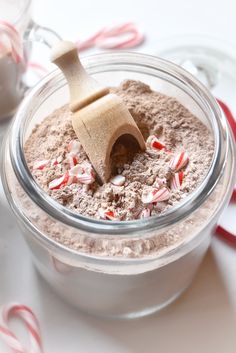 a jar filled with chocolate and candy canes