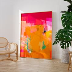 an abstract painting on the wall next to a chair and potted plant