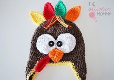 a crocheted turkey hat is shown on a table