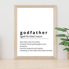 a framed poster with the words godfaither on it next to a potted plant