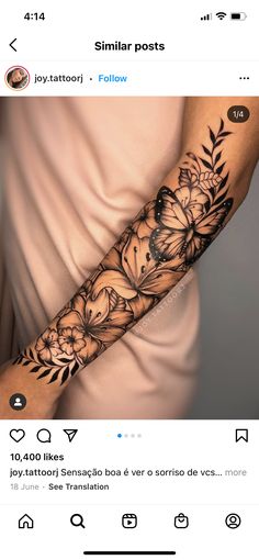 a woman's arm with flowers and butterflies on it