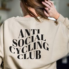 Anti Social Cycling Club crewneck sweatshirt, cycling sweatshirt, spin sweatshirt,  indoor cycling sweatshirt, cycling work out shirt, spin The perfect pump cover for the gym girly! **UNISEX** heavy blend crewneck sweatshirts are made from polyester and cotton. Runs true to size. Size up for loose fit. See size chart for measurements.  Standard shipping in 3-5 days  *returns and exchanges*  -items are made to order. Cancellations are not available. Orders cannot be changed or canceled once place Indoor Cycling Outfit, Workout Sweatshirt Crew Neck Sweat Resistant, Workout Crew Neck Sweatshirt, Sweat-resistant Crew Neck Sweatshirt For Workout, Gym Crew Neck Sweat-resistant Sweatshirt, Sweat-resistant Crew Neck Sweatshirt For Gym, Functional Moisture-wicking Crew Neck Sweatshirt, Functional Cotton Crew Neck Sweatshirt, Functional Crew Neck Sweatshirt For Workout