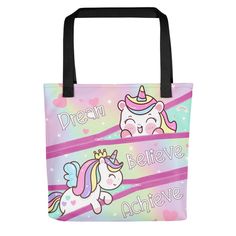 Girls Unicorn Tote Bag. Perfect gift for girl's birthday! Adorable unicorns peeking out of zipper pockets with inspirational quote dream, believe, achieve. in cute unicorn font. Great as a beach bag, after-school activities, book bag, and much more! SAME DESIGN PRINTED ON BOTH SIDES * 100% spun polyester fabric * Bag size: 15″ × 15″ (38.1 × 38.1 cm) * Dual handles made from 100% natural cotton bull denim * Handle length 11.8″ (30 cm), width 1″ (2.5 cm) * The handles can slightly differ depending Cute Pink Unicorn Print Bags, Cute Unicorn Print Bags For Everyday, Pink Unicorn Print Bag For Everyday Use, Cute Bags With Unicorn Print, Cute Unicorn Print Bag, Playful Multicolor Bag With Unicorn Print, Playful Multicolor Unicorn Print Bag, Playful Multicolor Unicorn Print Bags, Playful Bags With Unicorn Print For Everyday Use