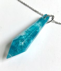 "Pendants made with epoxy resin and pigments! Handmade in Montreal by myself! Each piece is 100% unique, scratch resistant and durable. (pendants only, no chain included!) TO ADD A CHAIN: Go to the ETSY shop \"theBeadsOfDreams\", located in Shannon, Québec. They offer a variety of sterling silver chains, for around 10$ shipping included. I always buy my chains there ;) #NOTsponsored just a happy customer :)  To add the 24\" sterling silver chain: https://www.etsy.com/ca-fr/listing/648589435/collier-en-acier-inoxydable-24-chaine?ref=cart  For other lenghts, go in the section \"sterling silver\" of their shop :) -------- Pendentif faits en résine epoxy à laquelle j'ai ajouter des pigments. Faits par moi-même à Montréal. Chaque pièce est 100% unique, résistante aux égratignures. (pendentif se Blue Spiritual Resin Necklaces, Blue Spiritual Resin Necklace, Turquoise Resin Pendant Necklaces, Turquoise Resin Pendant Necklace, Resin Pendant, Montreal, Sterling Silver Chains, Arrow Necklace, Jewelry Necklace Pendant