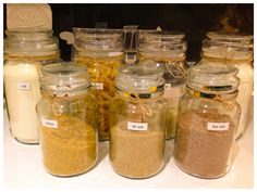 several jars filled with different types of food