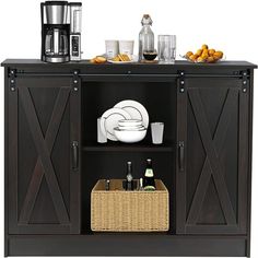 an entertainment center with baskets and drinks on it