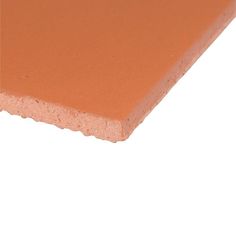 an orange colored plastic sheet on a white background