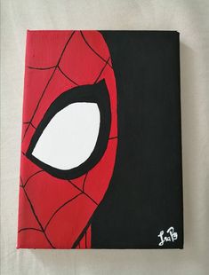 a spiderman face painted on a black and red canvas