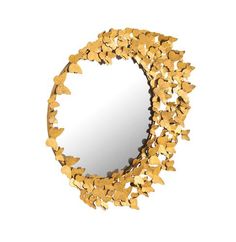 a mirror that has some gold leaves on it