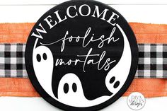 a black and white sign that says welcome to the halloween season