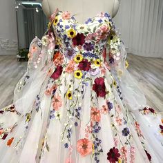 a white dress with colorful flowers on it