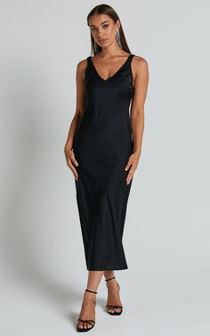 Turn heads and make a statement in our Agnia Midi Dress. This stunning black satin slip dress is the perfect choice for your next cocktail event or special occasion. The plunging neckline adds a touch of allure, while the elasticated back strap detail ensures a comfortable and secure fit all night long. Made from high-quality polyester, this sleeveless dress combines style with comfort, making it an essential addition to your wardrobe. Whether you're hitting the dance floor or sipping cocktails Night V-neck Dress With Satin Finish, Satin V-neck Night Dress, Modal Satin V-neck Party Dress, Elegant Sleeveless Satin Dress For Night, Satin V-neck Dress For Night, V-neck Satin Dress For Night, Elegant Satin V-neck Dress For Night, Elegant V-neck Satin Night Dress, Black Backless Bias Cut Slip Dress