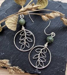 Beautiful handcrafted silver hammered hoops with delicate wire hand shaped branches in the centre. Adorned with natural green quartz beads Lightweight and dainty, comfortable to wear  Measurements: 5cm long including hook Silver plated french hooks The designs may differ ever so slightly due to the nature of the wire and the shaping process.  All orders will arrive neatly, wrapped in ecofriendly friendly packaging If you are ordering as a gift, please let us know at the checkout and we can arrange to add a personalised note in your order for you if you wish Vine Jewelry, Wire Wrap Jewelry Designs, Plant Jewelry, Boho Jewellery, Nature Earrings, Wire Jewelry Designs, Earrings Inspiration, Handmade Wire Jewelry, Nature Inspired Jewelry