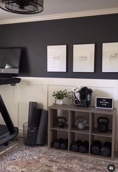 there is a treadmill in the room with pictures on the wall and other items