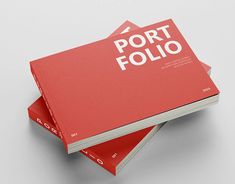 three red business cards with the word port folio printed on them are stacked in front of each other