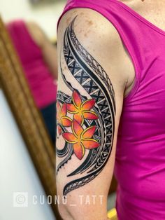 a woman with a flower tattoo on her arm