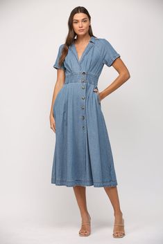 -Color: Denim -V-neck collar -Short sleeves -Side pockets -Elastic waist -Opening on back -Front button closure -Content: 100% Cotton -Hand wash/ Hang to wash -Runs true to size -Imported -Model is wearing a size Small Wrap Midi Dress, Tiered Maxi Dress, Short Jumpsuit, Cardigan Jacket, Summer Of Love, Denim Wash, Bottoms Pants, Dress Shop, Knit Top