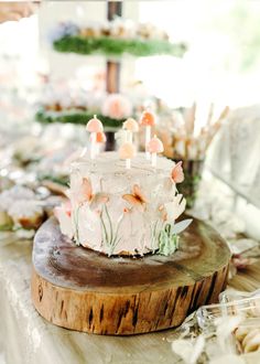 a white cake sitting on top of a wooden table