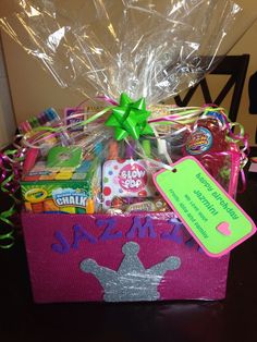 a pink gift box filled with candy and candies for someone's special occasion