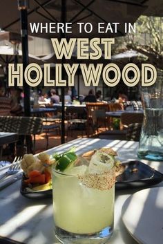 there is a drink on the table with words overlay that says where to eat in west hollywood