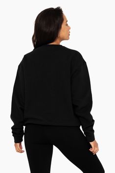 Indulge in laid-back luxury with our Unisex Crewneck in Onyx. Featuring drop shoulders, an oversized fit, and a timeless crew neckline, it's perfect for lounging or casual outings. Embroidered with the SET logo on the upper left chest, it adds a stylish flair to your wardrobe. Oversized Sweater With Ribbed Crew Neck, Oversized Crew Neck Sweater With Ribbed Cuffs, Boxy Fit Crew Neck Sweater With Ribbed Neckline, Boxy Fit Crew Sweatshirt With Ribbed Cuffs, Oversized Crew Sweatshirt, Oversized Crew Neck Sweats With Ribbed Cuffs, Oversized Crew Neck Sweater, Boxy Crew Neck Sweater For Streetwear, Black Boxy Fit Sweatshirt For Loungewear