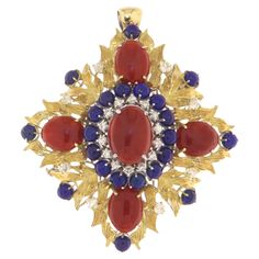 This exquisite brooch/pendant is a wearable piece of art that reflects the opulence and elegance of a blend of precious stones and metals. Crafted in a harmonious mix of 18 karat yellow and white gold, the piece showcases a radiant and lavish design that instantly captivates the beholder. At the heart of the design, majestic ovals of Sardinian red coral stand proud, their polished surface and vibrant hue pay homage to the sea and the wild nature of the island from which they hail. These gems are Lapis Lazuli Stone, Gold Brooches, Wild Nature, Shiny Things, Red Coral, Lapis Lazuli, Precious Stones, Brooches, Jewelry Necklace Pendant