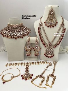 an assortment of jewelry is displayed on a mannequin