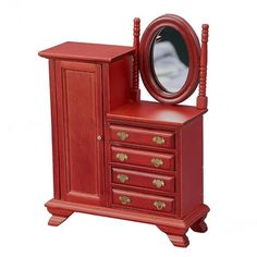 a small red dresser with a mirror on it