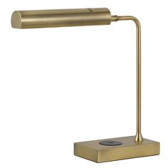 a gold desk lamp on a white background