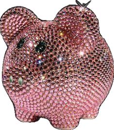 a pink teddy bear shaped ornament with sequins