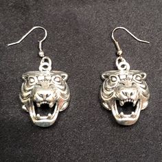 “In Any Jungle, What Is The Rarest Of Animalsthe Creature That Comes Along Only Once In A Generation?” “The White Tiger.” “That’s What You Are, In This Jungle.” - Antiqued Silver Metal Fierce Tiger Charms. - Charms Measure Approximately 1 X 1 Inch. - Silver Metal Fish Hook Style Earrings. - Clear Rubber Earring Backings Included Upon Request! Make A Statement With These Vicious, Fierce, Powerful, And Unique Tiger Earrings! Channel Your Inner Tiger King / Joe Exotic / Carole Baskin Cat Jungle, Carole Baskin, Fierce Tiger, Tiger Earrings, Joe Exotic, Tiger King, Metal Fish, Earrings Big, White Tiger