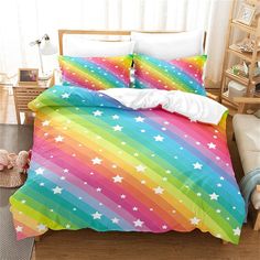 a rainbow colored bed with white stars on it