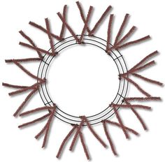 a circular frame made up of small red sticks in the shape of a sunburst