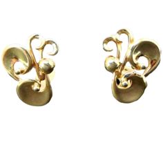 Barclay Large Gold Tone Swirl Clip On Earrings Designer Signed Clip Ons Vintage Jewelry Mid Century  Presented by EclecticVintager,These vintage designer signed Barclay earrings are large and chunky swirls of gold tone. The earrings are clip on style. Approximate Measurements:  1.5 inches by 1 inch  Circa - 1960's Hallmark - Barclay Materials -  gold tone metal  More clip on earrings - https://etsy.me/2ybPLC4 More designer earrings - https://etsy.me/2PVZLFv My Etsy Shop - https://www.etsy.com/sh Cats Eye Ring, Rhinestone Choker Necklace, Swirl Earrings, Rhinestone Choker, Earrings Clip, Statement Ring Silver, Earrings In Gold, Vintage Designer, Gorgeous Earrings