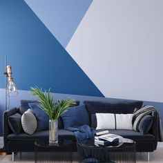 a living room with blue and white walls