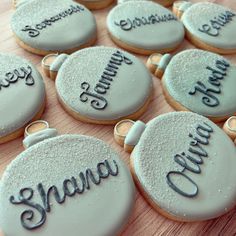 some cookies that are sitting on top of a wooden table with the words grandma written on them