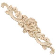 a white rose with leaves and scrolls is shown on the side of a door handle