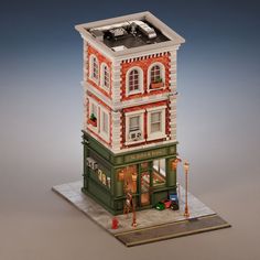 a model of a building with a car on top