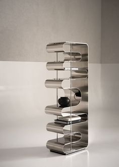 a metal object with multiple compartments on it