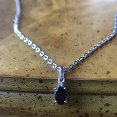 This Minimalist Necklace Is Made With A Genuine Rhodolite Garnet. The Pendant Is Set In Solid .925 Sterling Silver, And It Also Has A Rhodium Plate To Prevent Tarnishing. I Also Am Including A Solid 20” Stainless Steel Chain To Go With The Pendant. Stainless Steel Is A Durable And Hypoallergenic Metal And Is Perfect For Everyday Use. Please See Photos For Gemstone Quality As Well As Pendant Measurement. Never Worn. J13 Garnet Jewelry, Rhodolite Garnet, Steel Necklace, Minimalist Necklace, Stainless Steel Necklace, Steel Chain, Stainless Steel Chain, Solid 925 Sterling Silver, Rhodium Plated