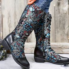 Women's Faux Leather And Fabric Knee High Embroidered Dress Boots. Boots Have A 1 Inch Block Heel With A Rubber Sole And Lace Up The Front With A Zipper On The Inside Of The Leg For Easy On And Off. The Almond Shaped Toe And Back Of The Heel Are Capped With Black Faux Leather. Top Of Boot Foot And All Of Shank Are Covered In Beautiful Blue, Red, And Silver Embroidery Set On A Black Background. These Are Perfect For Festivals, Parties, Cosplay, And Every Day Wear No Matter The Season Or Weather. Silver Embroidery, Faux Leather Top, Embroidered Boots, Red And Silver, Almond Shaped, Dress Boots, Embroidered Dress, Black Faux Leather, Dress With Boots