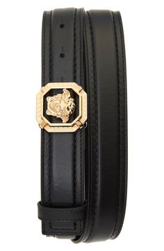 A serpentine goddess head defines the signature Versace buckle on a calfskin leather belt. Leather Made in Italy Luxury Black Belt Buckle For Evening, Luxury Black Belt Buckles For Evening, Luxury Black Evening Belt Buckles, Luxury Black Evening Belt Buckle, Luxury Leather Belt With Tang Buckle, Luxury Gold Leather Belt Buckles, Luxury Leather Belt Buckles For Evening, Luxury Formal Belt With Gold Buckle, Luxury Business Belt With Tang Buckle