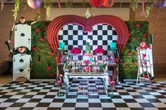 an elaborately decorated stage set up for a party with lots of decorations and decor